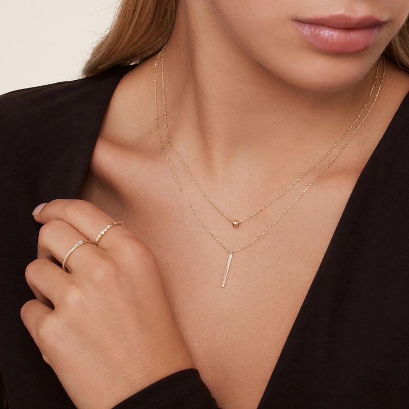 Gold necklace with vertical bar pendant on sale