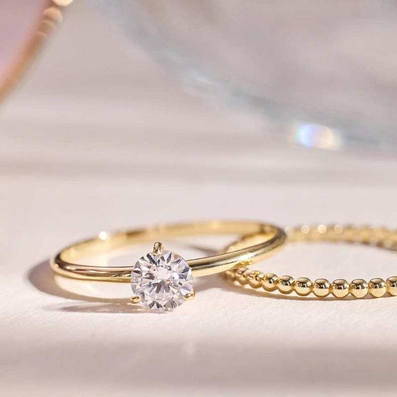 Three Prong Round Cut Cubic Zirconia Ring
